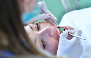 Relaxed woman receiving dental sedation