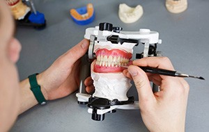 Factors that affect the cost of dentures include the materials they’re made of