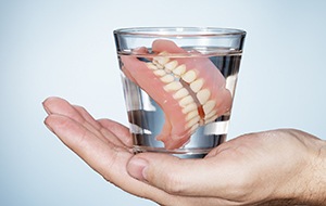 Full dentures in glass of water