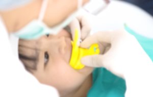 Child receiving fluoride treatment