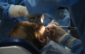 Woman getting dental surgery