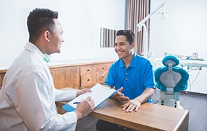 dentist consulting with a patient about Invisalign treatment