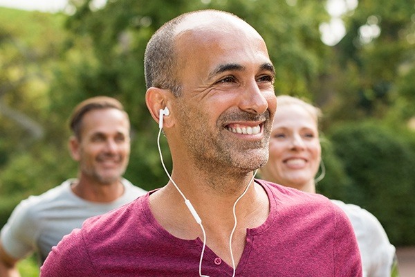 Man wearing headphones smiling
