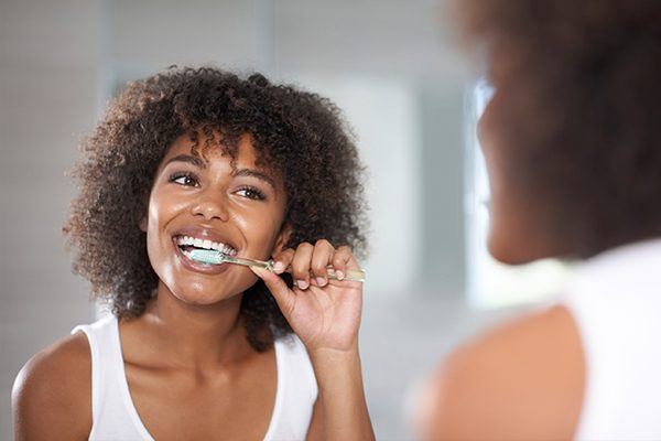 Woman brushing her teeth