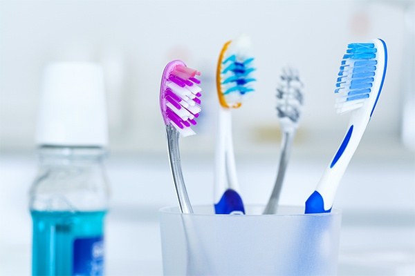 toothbrushes in a glass