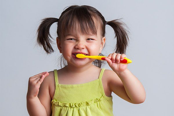 kid brushing teeth