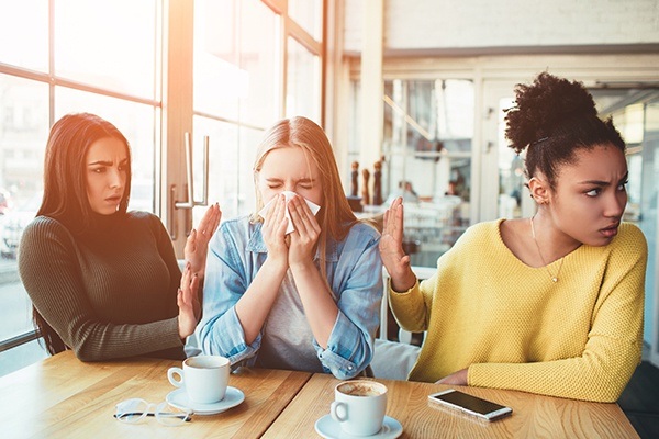 Woman sneezing