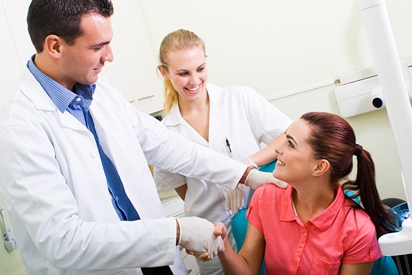 dentist greets patient