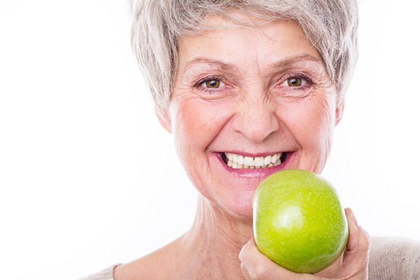 Woman holding apple