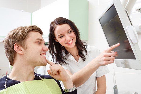 woman pointing to a screen