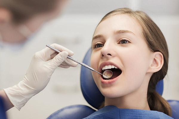 Girl getting a dental checkup