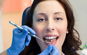 Woman receiving dental checkup