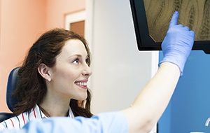 Woman looking at root canal x-rays