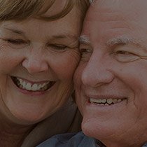 Senior man and woman smiling together