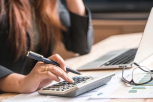 woman using calculator