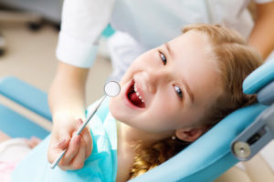 little girl at the dentist