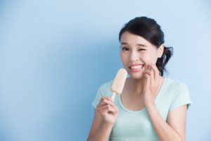 woman popsicle sensitive teeth