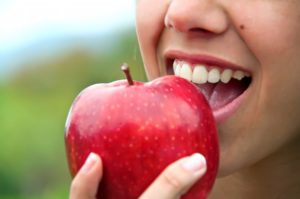 person eating apple