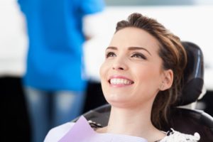 woman in dental chair waiting for dentist