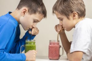 Boys drinking fruit smoothies