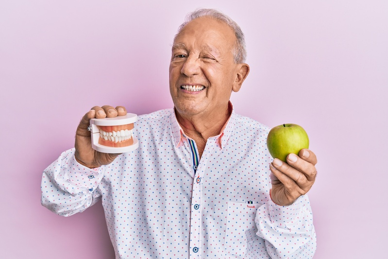 Man considering dentures and taste