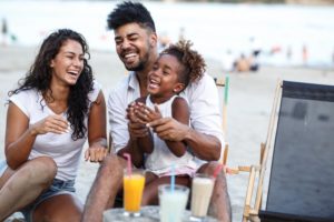 a family with beautiful smiles enjoying their summer vacation