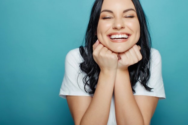 person with dental implants smiling